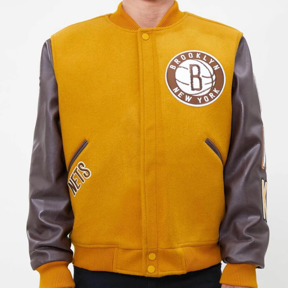 yellow and white varsity jacket